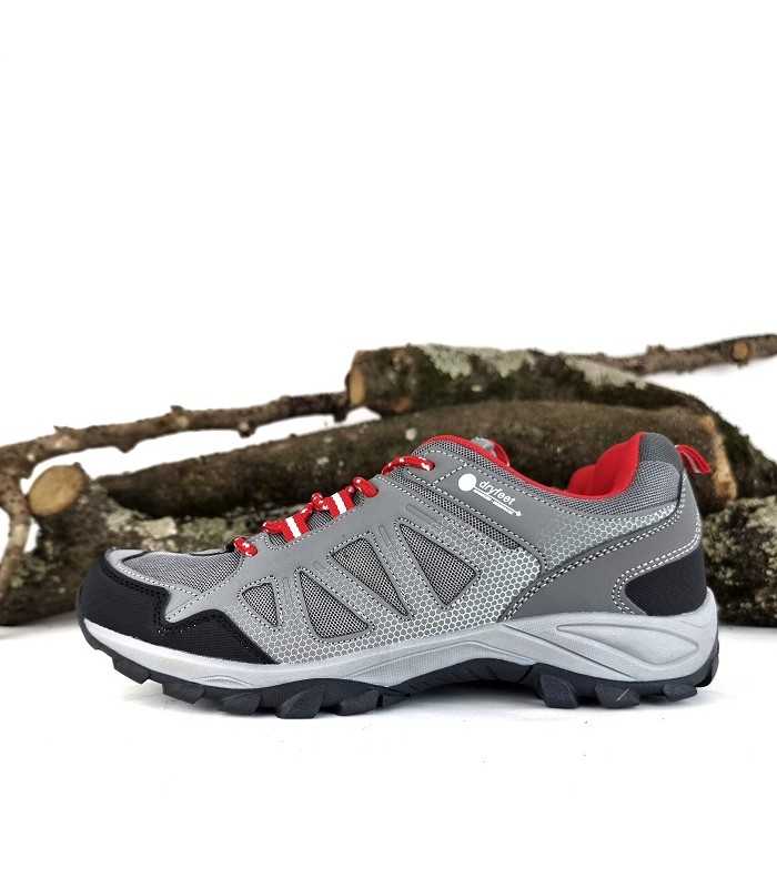 Vista de perfil de la zapatilla trekking Coachella hombre color gris