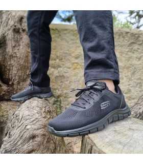 Deportivo hombre negro Track Broader de Skechers puesta en hombre con pantalón negro