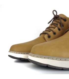 Foto detalle tejido : Textura de piel vegana amarilla bota Skechers.