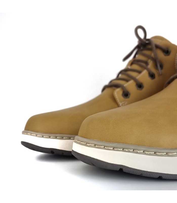 Foto detalle tejido : Textura de piel vegana amarilla bota Skechers.