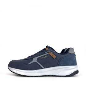 Vista lateral de la zapatilla en azul marino , destacando su diseño moderno y el cierre con cordones color navy