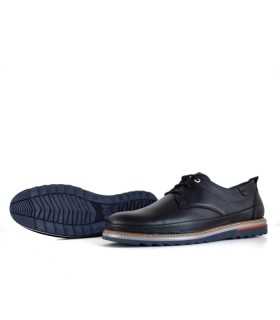 Vista inferior destacando la suela de caucho antideslizante, ideal para mayor estabilidad de zapato negro