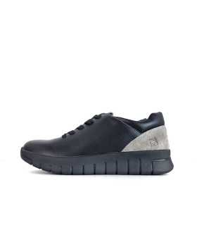 Vista de perfil del zapatos negro topo para mujer de Renature, con cierre de cordones y suela ligera tipo runner.