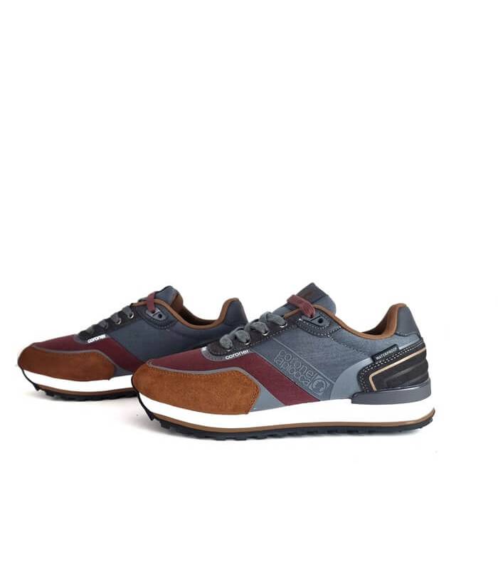 Zapatilla deportiva gris waterproof Coronel Tapioca en vista lateral.