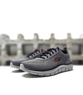 Vista de medio perfil de las zapatillas Skechers Track Leshur grises con cordones.