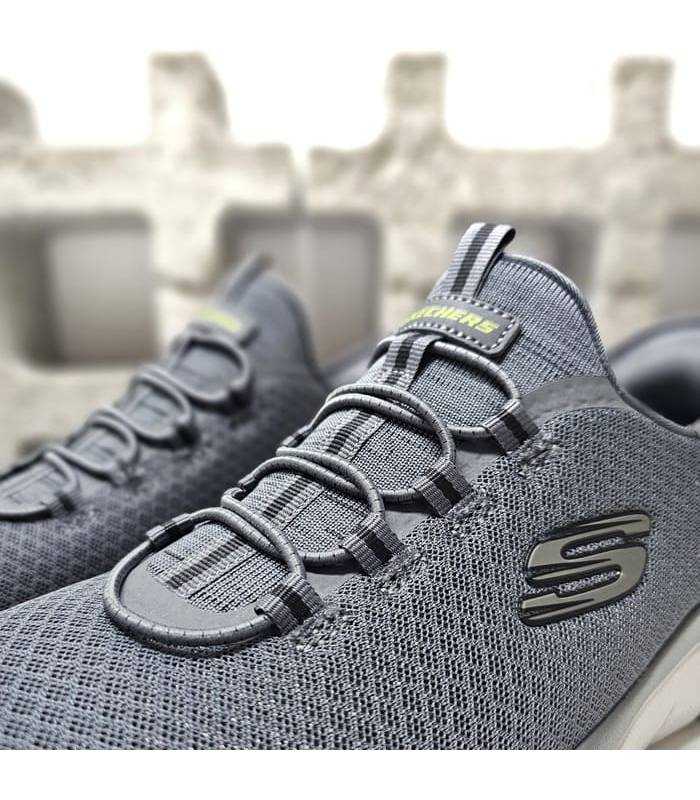 Detalle del tejido y cordones: Malla técnica transpirable en color gris marengo.