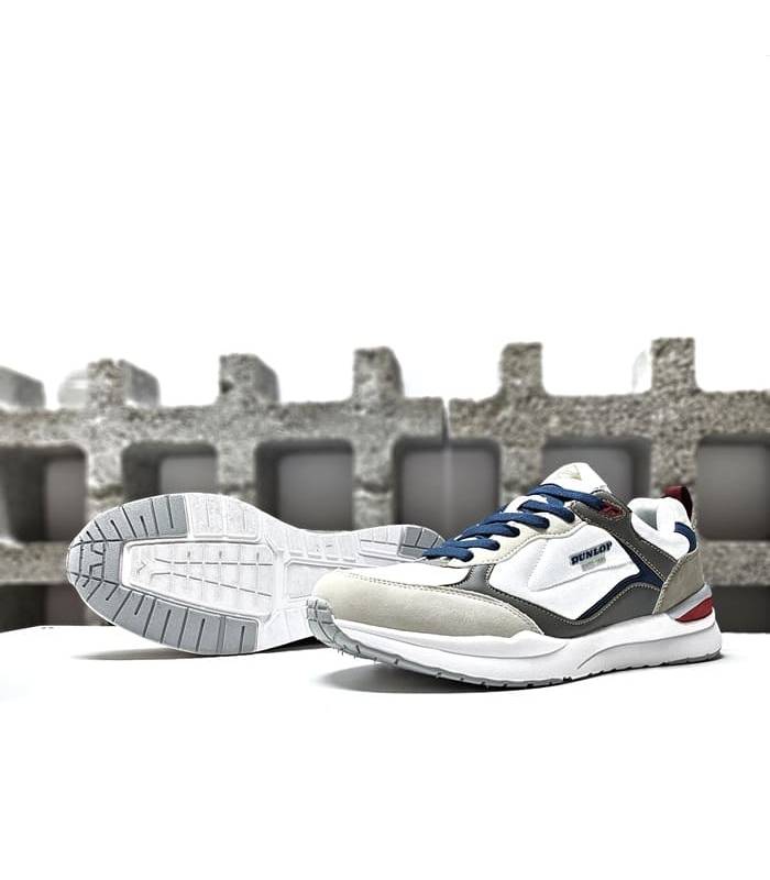 Suela sintética con tracción mejorada de las zapatillas blancas de Dunlop.