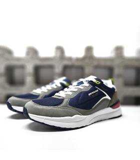 Vista semi Lateral en azul: Zapatillas urbanas Dunlop para hombre en color azul.