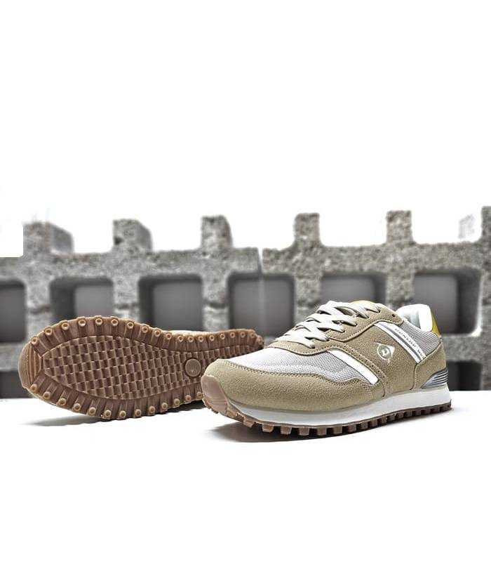 Detalle de la suela de goma antideslizante de las zapatillas deportivas para hombre de Dunlop color beige.