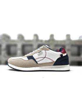 Vista lateral de las zapatillas Lois blnca para hombre con detalles en piel sintética.