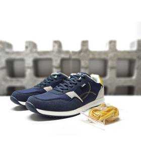 Zapatillas deportivas de hombre Lois en color azul con cordones amarillos intercambiables.
