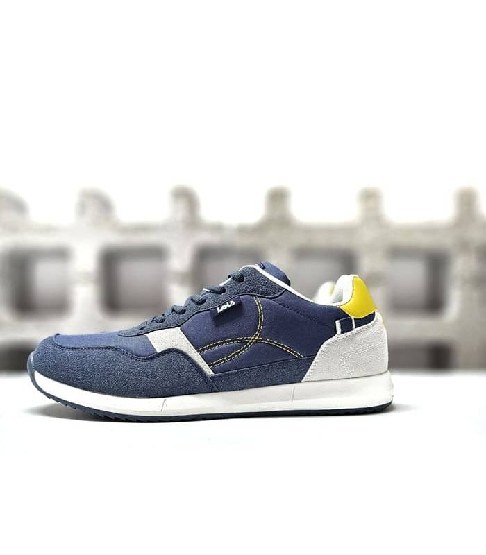 Vista lateral de las zapatillas Lois azul marino para hombre con detalles en piel sintética.