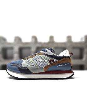 zapatilla Dunlop azul mostrando el diseño multicolor, el logo retro lateral y los cordones planos para un ajuste perfecto.
