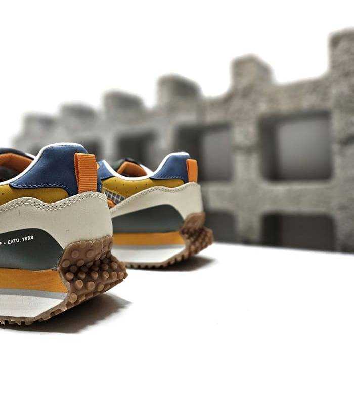 Detalle del talón acolchado y la entre suela tricolor de EVA en el deportivo casual hombre verde Dunlop.