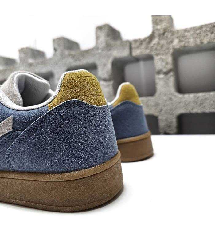 detalle amarillo talón zapatilla azul cielo mujer Paredes