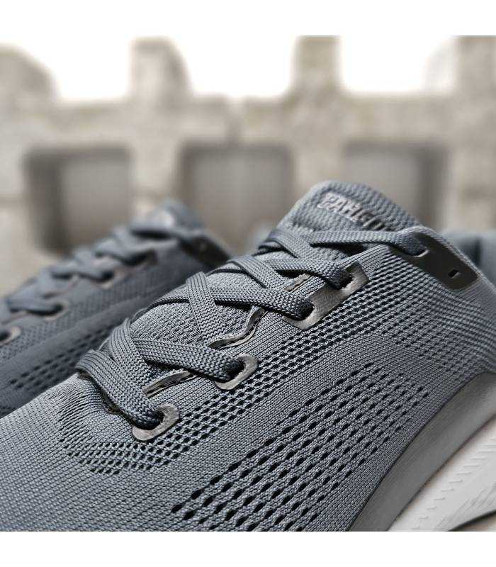 detalle tejido transpirable zapatilla deportiva gris hombre