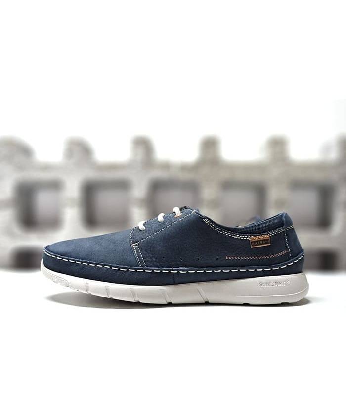 Vista lateral del zapato SCORPIO3990 en piel azul para hombre, con piso blanco ultraligero y costuras a contraste.