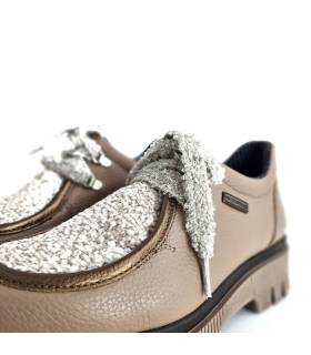 detalle depiel del mepine y cierre de cordones de los zapato de Nival
