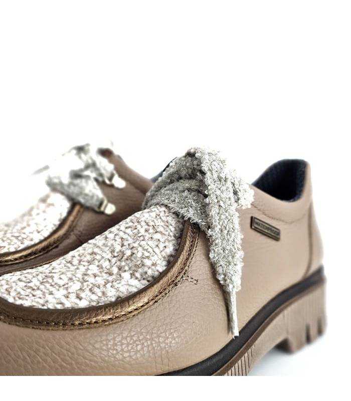 detalle depiel del mepine y cierre de cordones de los zapato de Nival
