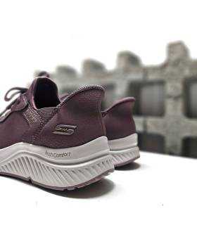vista trasera de las zapatillas de mujer de skecher co el sisteme slip-ins color lila