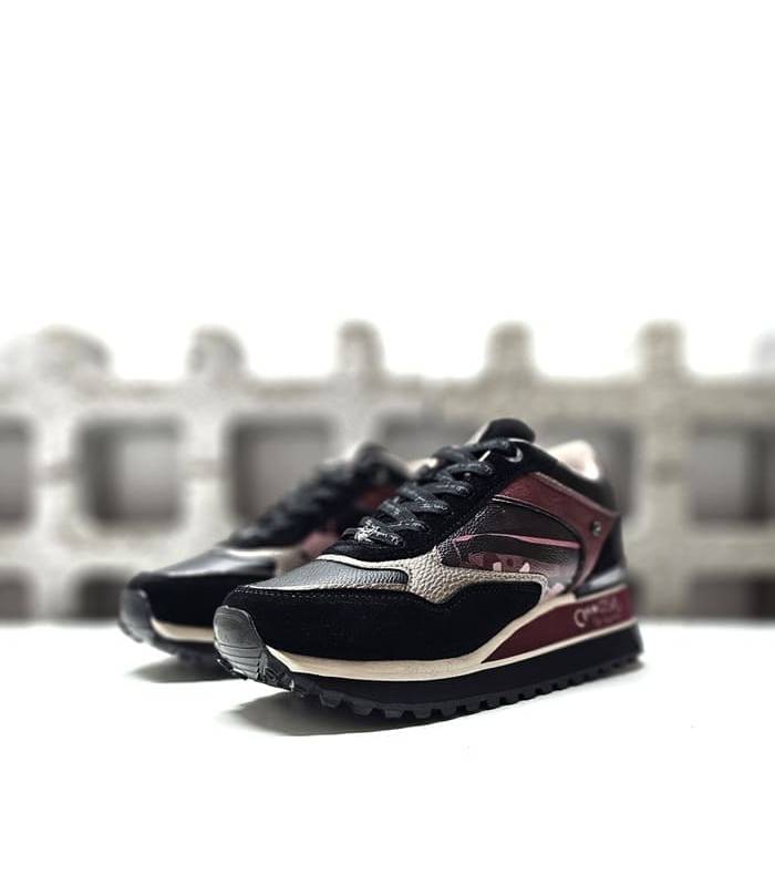 Deportivos plataforma mujer negro estampado Anekke vista diagonal