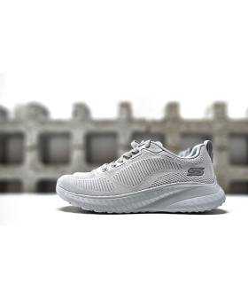 Vista lateral zapatillas Skechers  grises de rebajas