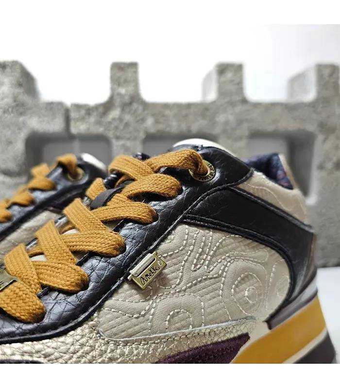 Detalle zapatillas Anekke London mujer cordones mostaza texturas laterales