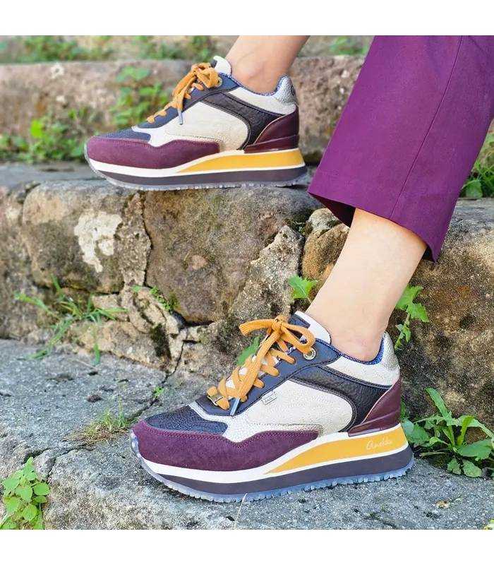 Zapatillas Anekke mujer plataforma London puestas con pantalón burdeos