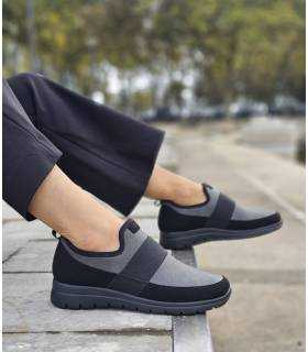 Zapatos FlyFlot mujer sin cordones puestos con pantalon negro
